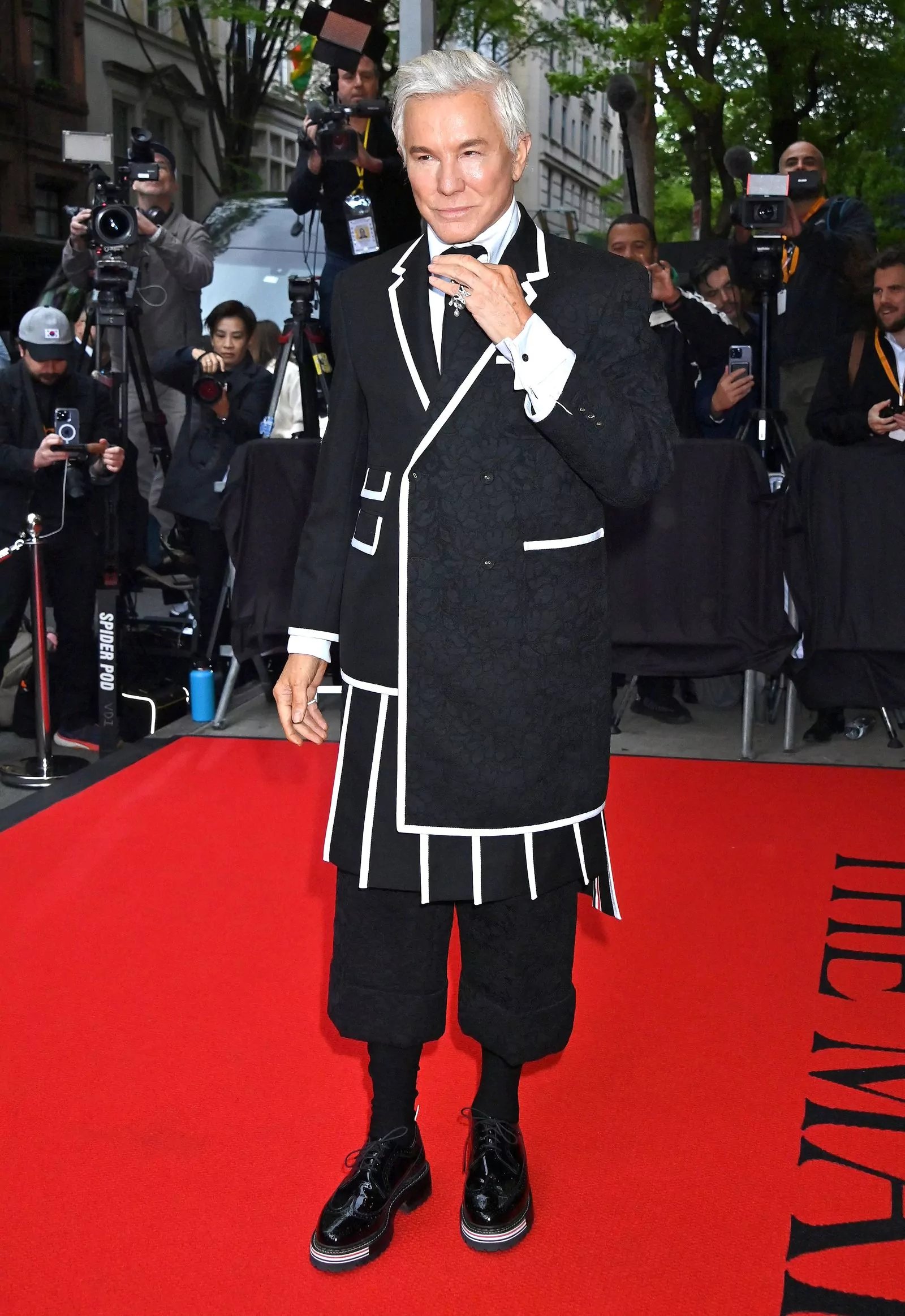 Baz Luhrmann in Thom Browne at the 2023 Met Gala, May 1, 2023. Baz Luhrmann in Thom Browne leaves The Mark Hotel before attending the Costume Institute Ball, May 1, 2023.