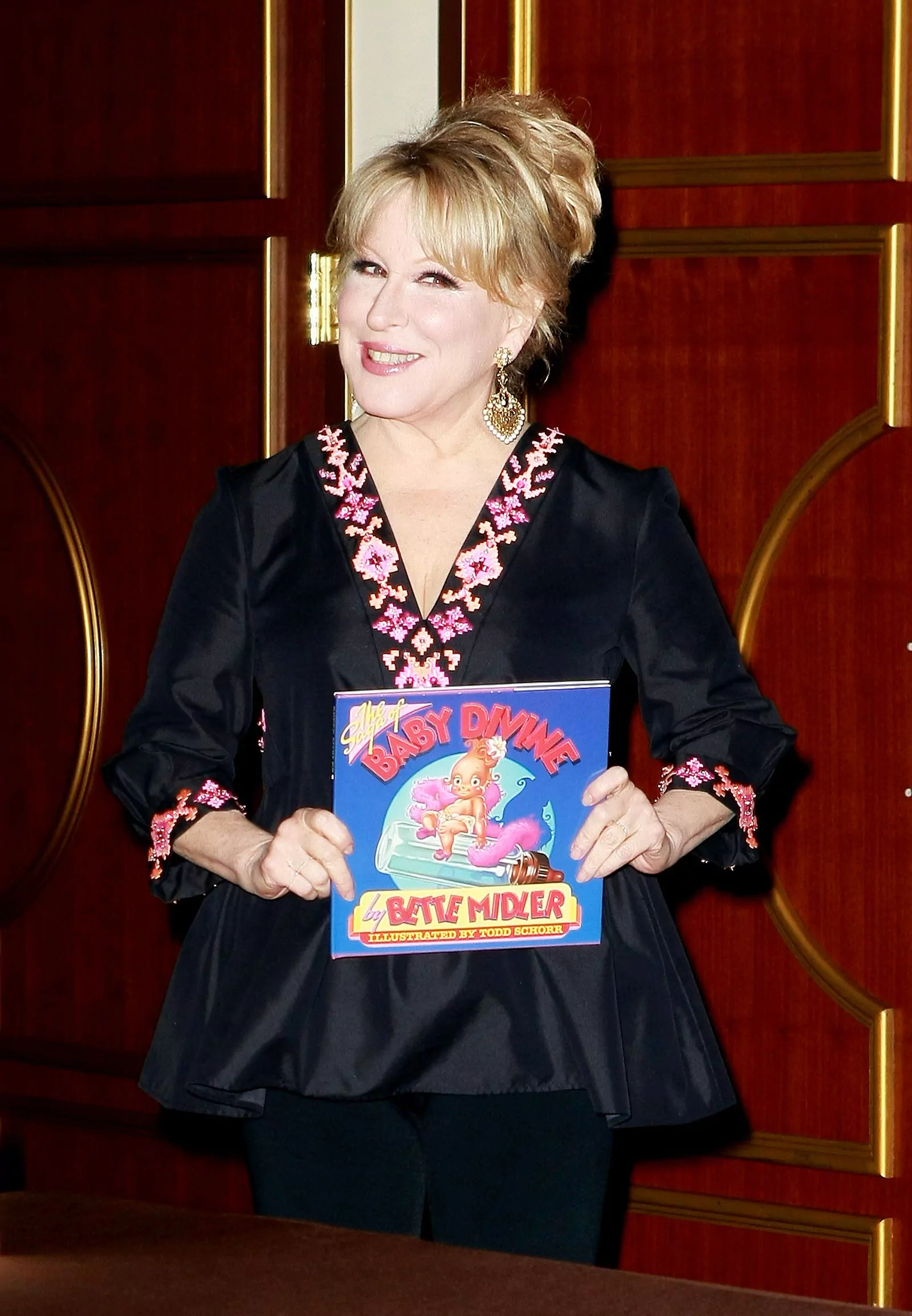 Bette Midler signs copies of her book "The Saga of Baby Divine" in Las Vegas on January 6, 2010.
