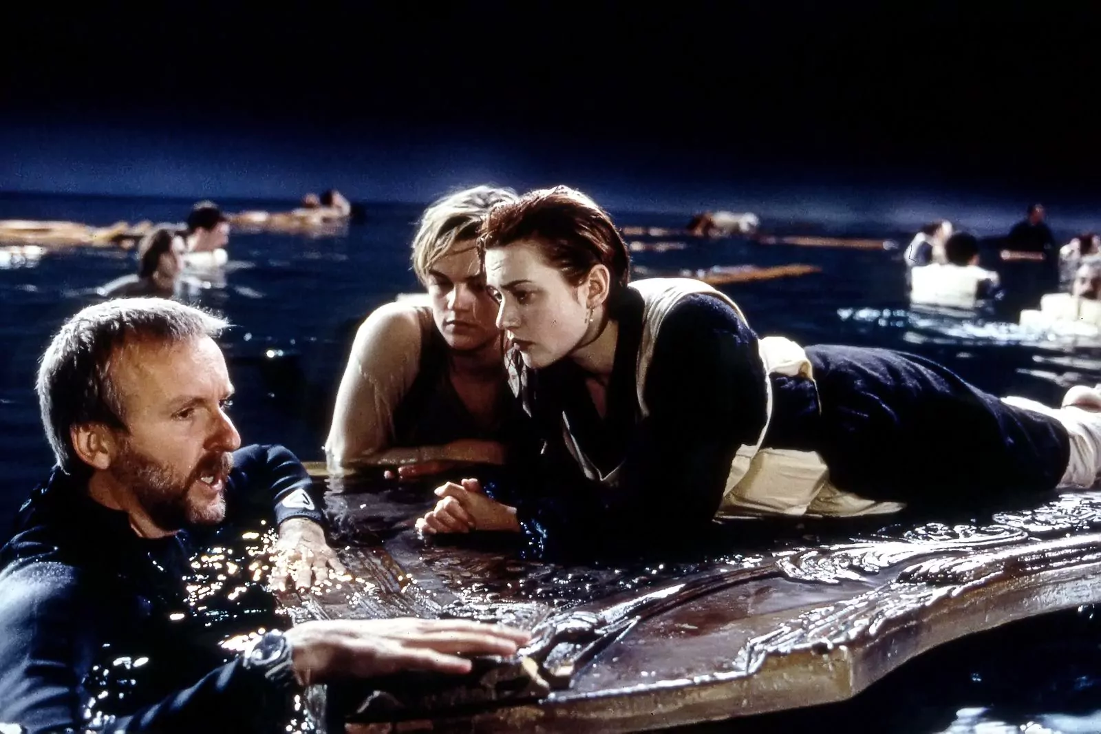 James Cameron, Leonardo DiCaprio and Kate Winslet on the set of Titanic, 1997.