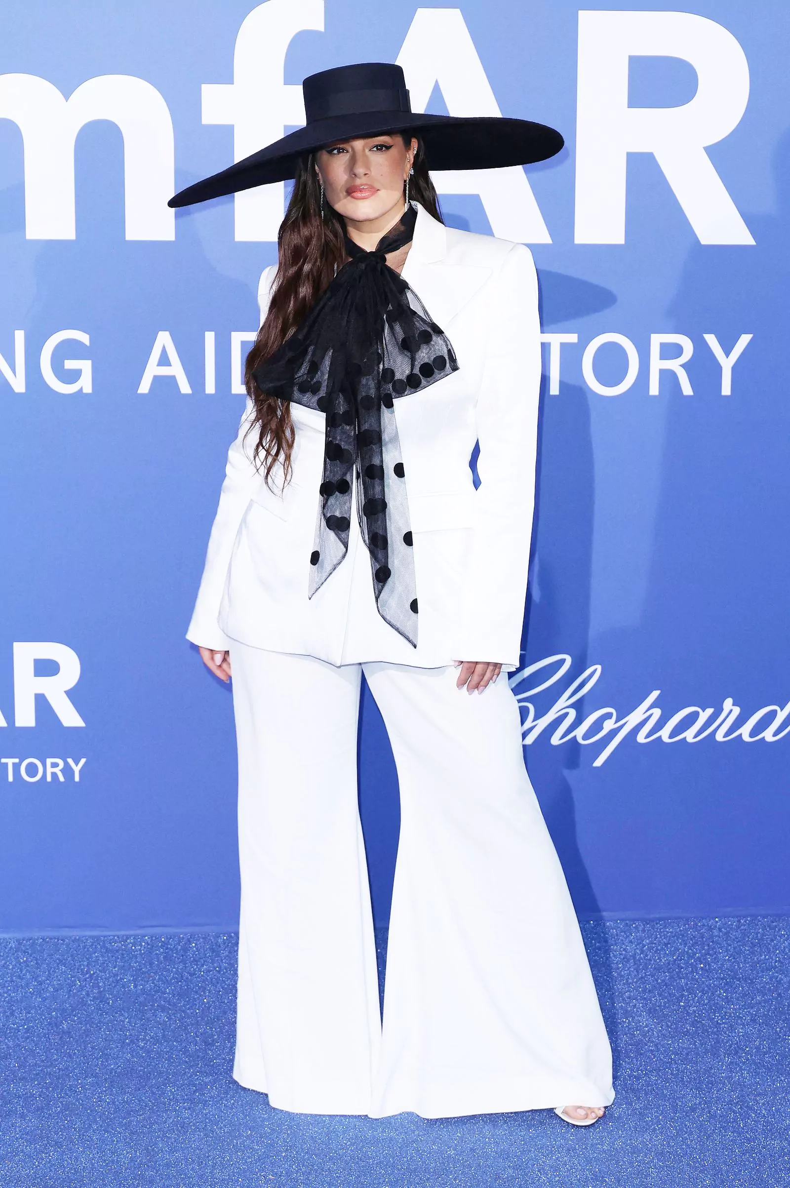 Ashley Graham wearing Nina Ricci Fall 2023, Chopard jewelry at the amfAR Gala, May 25, 2023. Ashley Graham wearing Nina Ricci Fall 2023, Chopard jewelry at the amfAR Gala Dinner in Cannes, May 25, 2023.