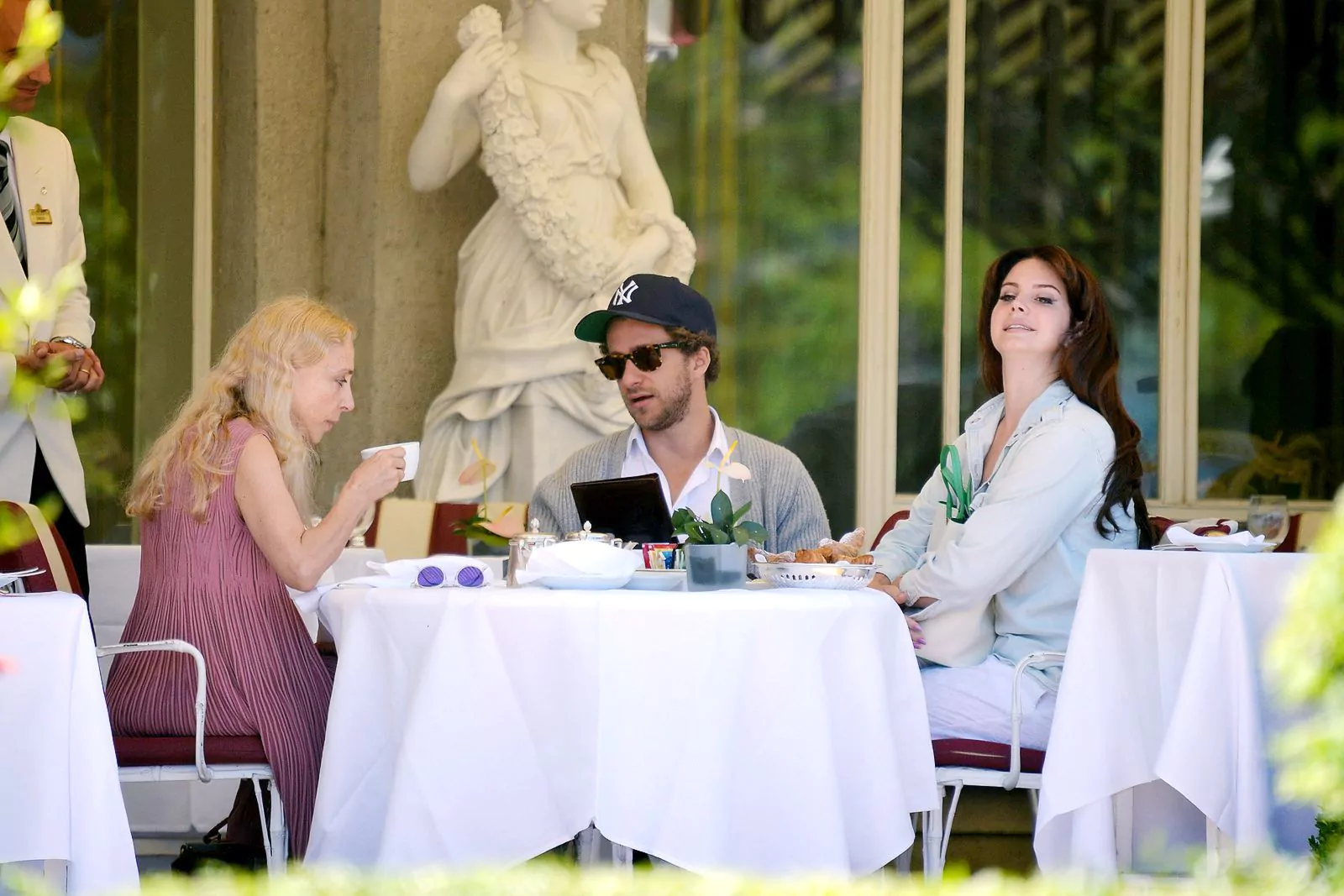 Franca Sozzani with son Francesco Carrozzini and his girlfriend Lana Del Rey while on vacation in Stresa, Italy, August 2, 2015.